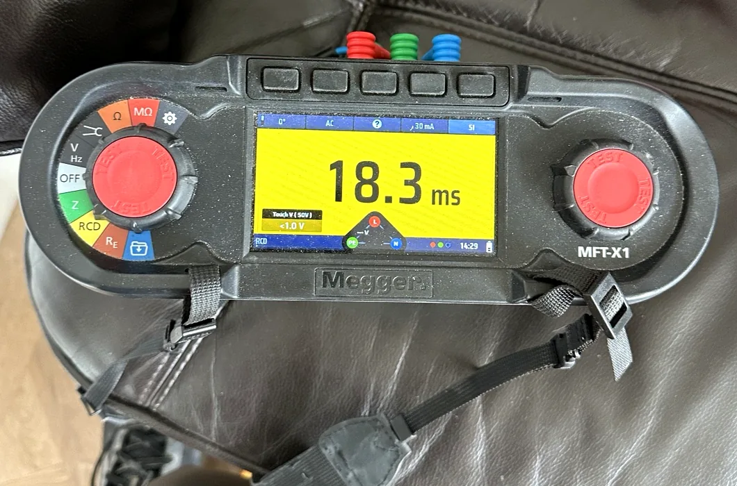 Megger multifunction tester displaying an RCD test reading of 18.3 milliseconds